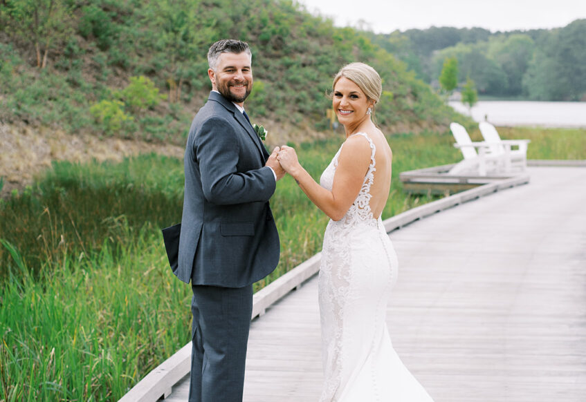 bride and groom on a pier