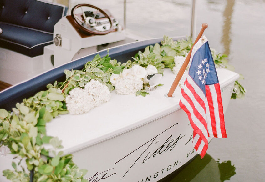 A duffy boat decorated with white flowers